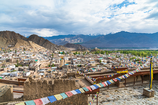 Prayer flag in Tsemo castle with beautiful mountain snow landscape background in Leh Ladakh