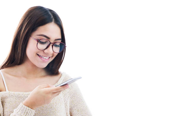 Female teenager sending a voice note using smartphone