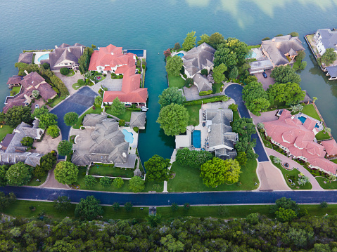 Looking down from above Colorful Luxury Rooftops on mansions in Mount Bonnell Sunrise in Austin Texas USA drone views looking straight down