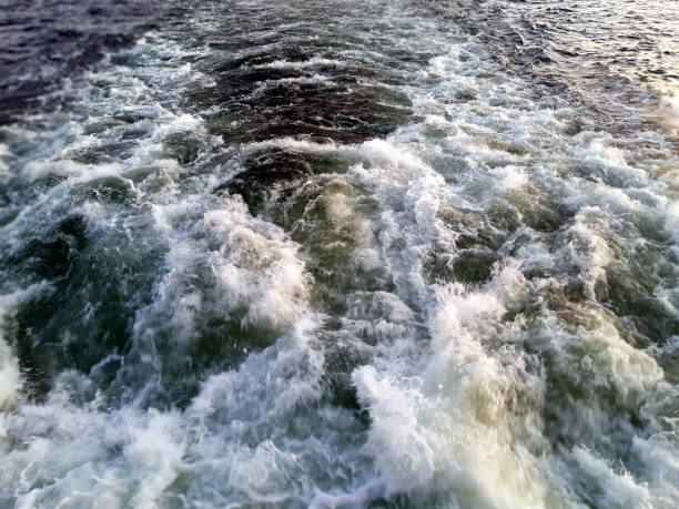istock Water Foams And Splashes Behind Vesse 1249404127