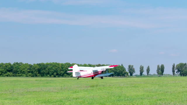A small airplane is taxiing on the runway.