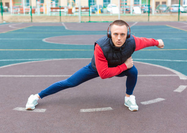 istock A man warming up his leg muscles before running 1249407690
