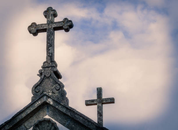 istock Two crosses in natural stone 1249409027
