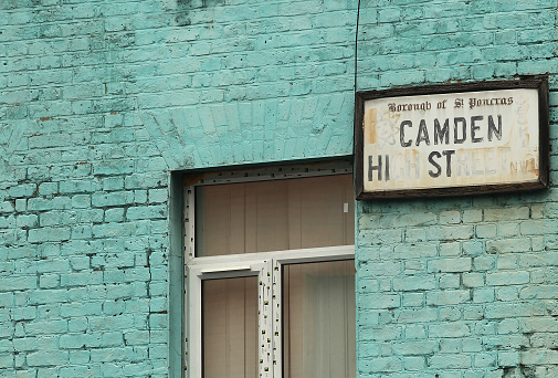 A general view of an old Camden High Street sign with missing letters in London, England