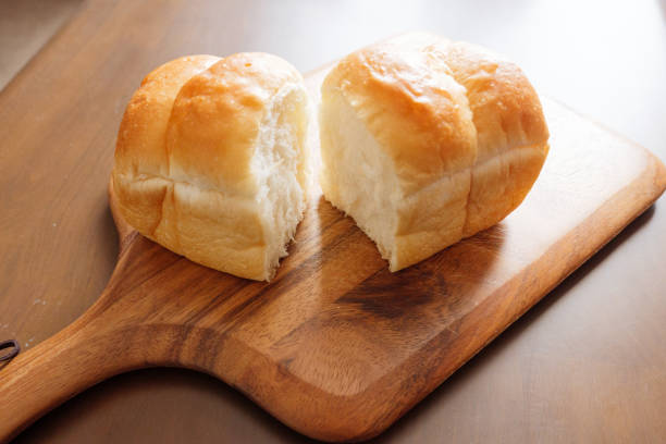 istock Tear homemade bread on a cutting board in half 1249415000