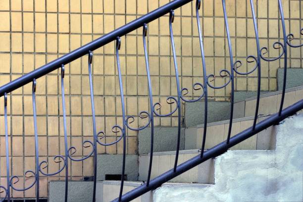 istock black iron handrails with a forged pattern on the stairs 1249420110