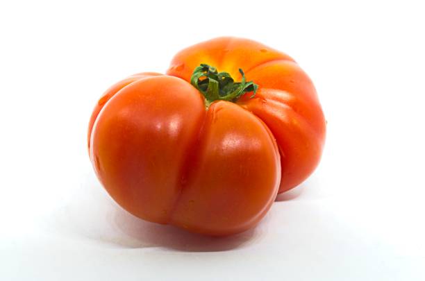 istock Red raf tomato on white background Fresh vegetable. Healthy eating 1249421159