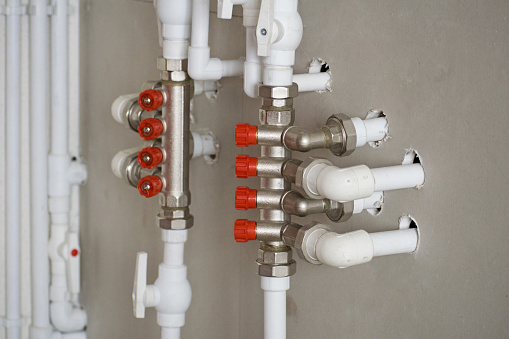 Gas pipe and valve on the wall. Pipes of gas system in boiler room.