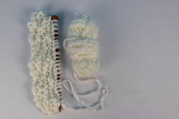 istock Creative knitting background needles with thick and thin art yarn 1249432737
