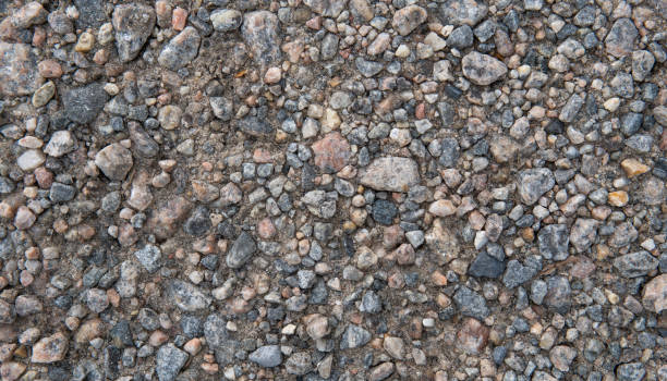 istock Multi colored pebbles background. Natural stone. Close-up texture of pebbles 1249434581
