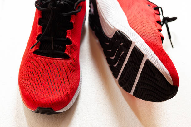 istock Red sneakers isolated on white 1249437304