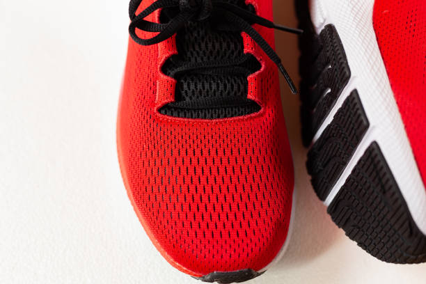 istock Red sneakers isolated on white 1249437306