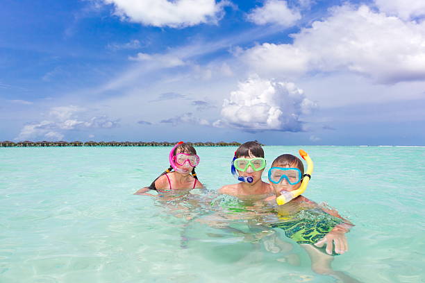 istock Children snorkeling in sea 124943740