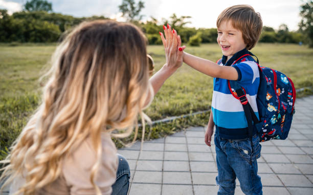 istock Little boy give high five his mom 1249439063