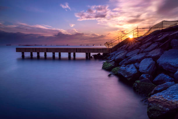 istock Wooden pier on blue sea 1249439585