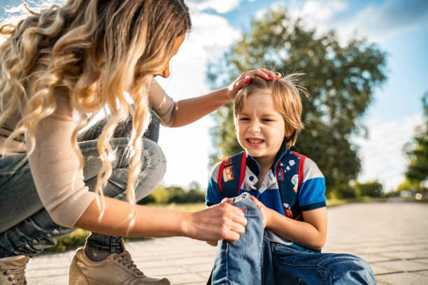 istock Little boy injured his knee 1249440107