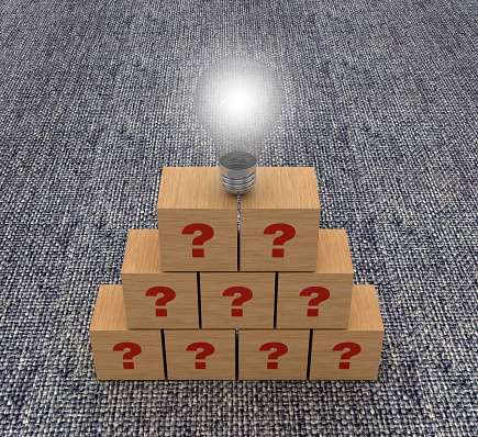 Wood Blocks with Questions and Light Bulb on Carpet Background - 3D Rendering