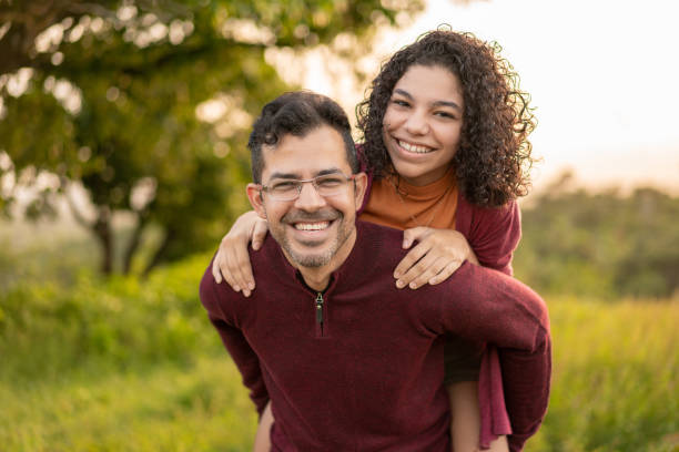 istock Father carrying his daughter 1249441360