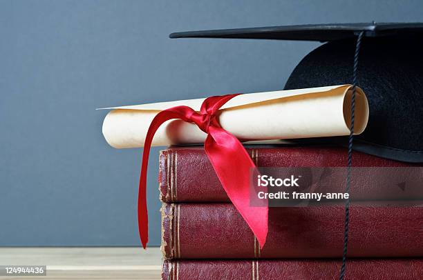 Graduation Cap Scroll And Books Stock Photo - Download Image Now - Achievement, Award, Award Ribbon