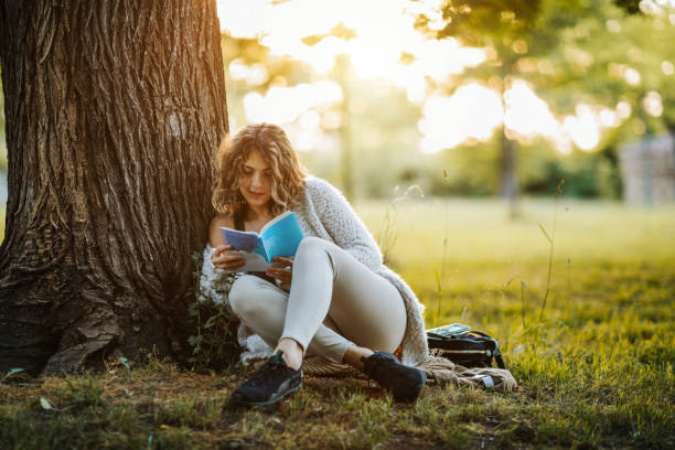 istock Enjoying book in silence of nature 1249446235
