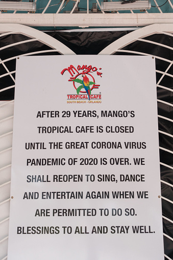 June 13, 2020 - Miami Beach, Florida USA - Mango's Tropical Cafe, a famous restaurant and nightclub on Ocean Drive, displays a closed sign during the coronavirus pandemic.