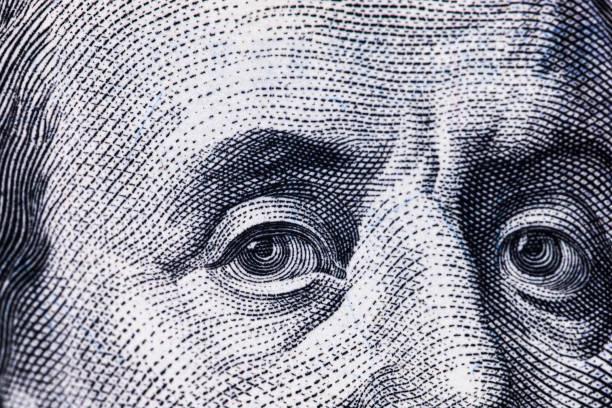 istock Macro close up of Ben Franklin's face on the US $100 dollar bill. 1249448745