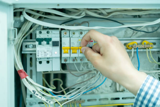 istock the professional electricity worker fixing the home lighting power problem, swithing the power panel 1249450311