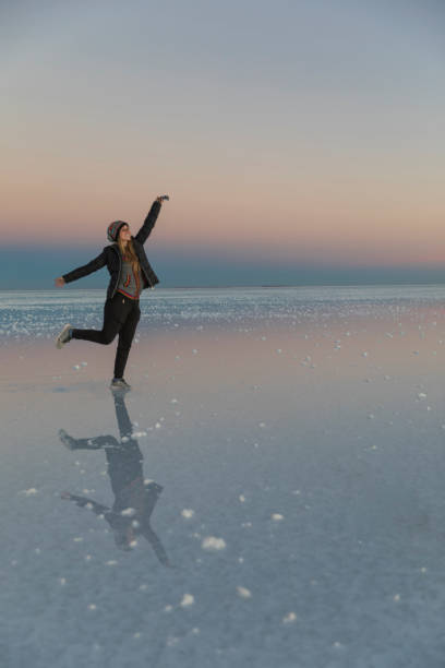 istock Woman posing in salt flats with nice reflections. Dreamy. 1249450374