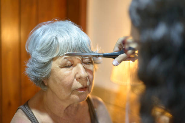 istock Woman having a haircut at home quarantine 1249450496