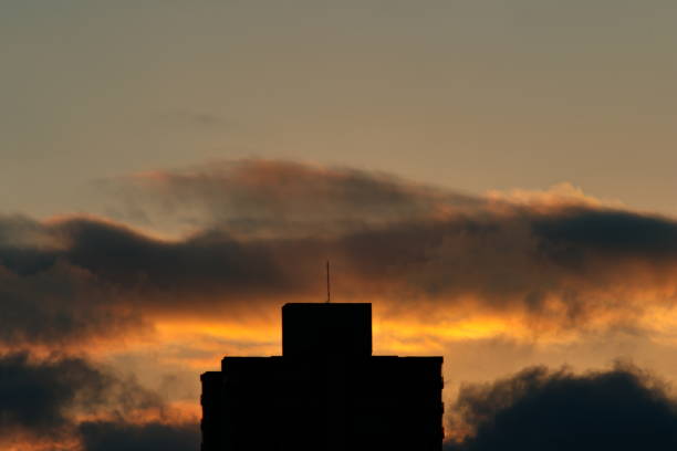 silhouette of a building with twilight-lit cloud in the background - POA, SAO PAULO, BRAZIL.