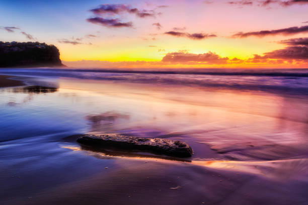 istock Sea Bungan Beach dark sand 1 stone 1249457321