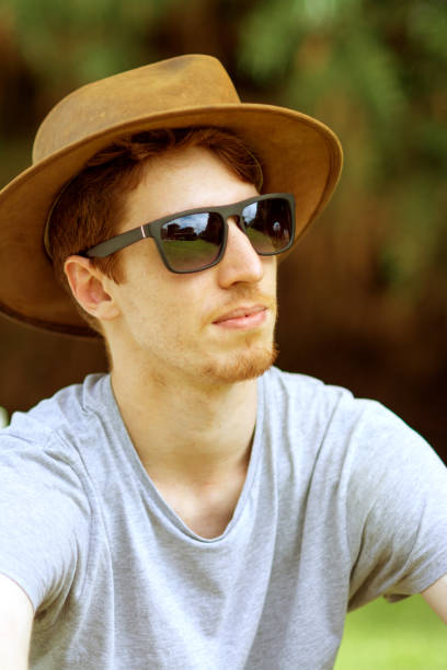 istock Portrait of a young man using hat 1249461501