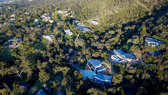 Aerial view of Australian hillside homes and trees