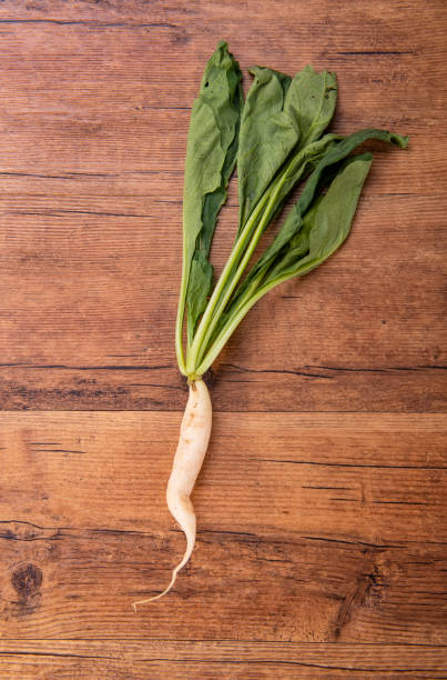 istock Daikon radish on the wood background 1249464139