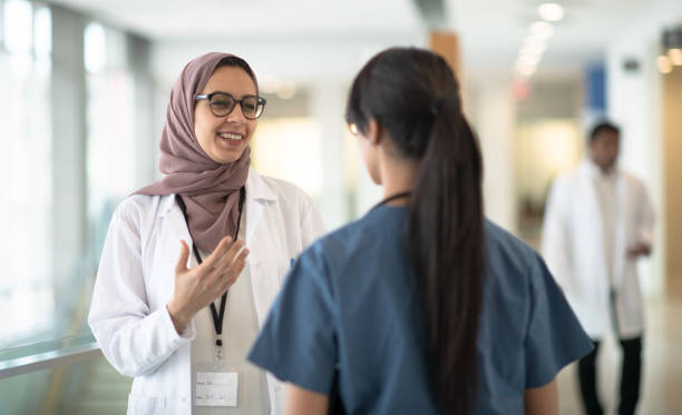 istock Female nurse discussing with doctor 1249466941