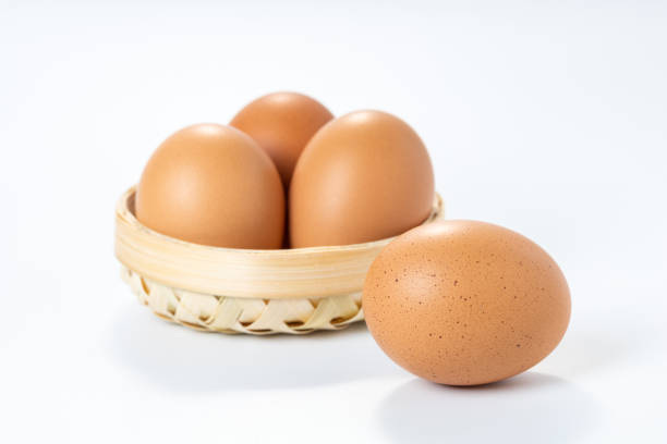 Eggs in the Basket on White Background