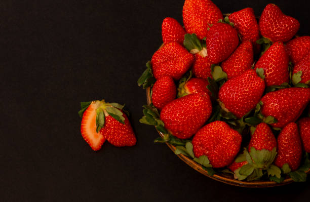Strawberries in ceramic bowl stock photo