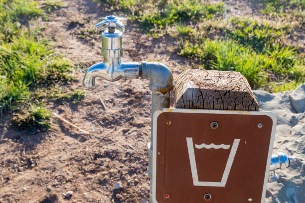 This outdoor faucet found at a State Park in Utah, USA, has a sign showing that the water is drinkable.