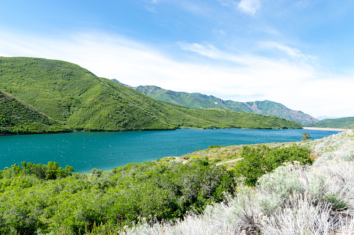 This shot was taken from the hill overlooking the Little Dell reservoir and recreational area.  The vegetation around the water is especially green after a wet spring and summer.