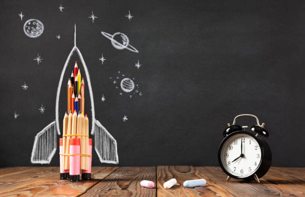 istock Back to School Concept with Hand Drawn Rocket on Blackboard 1249469297