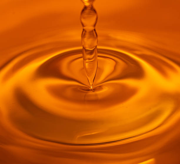 istock Close up of a water drop on orange water 1249471302
