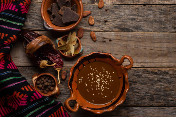 istock Mexican mole sauce on wooden background 1249476208