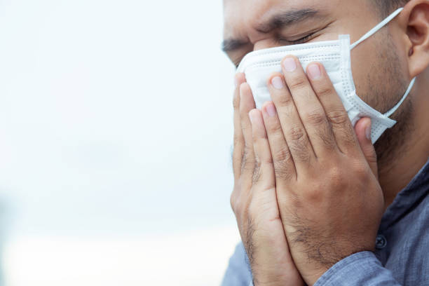 istock Men wearing masks to protect the corona virus 1249478087