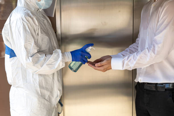 istock Apply Alcohol gel for hands sanitation before entering business office 1249478112