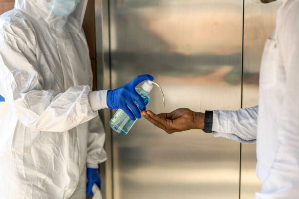 istock Apply Alcohol gel for hands sanitation before entering business office 1249478113