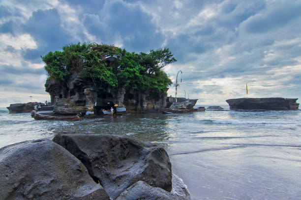 istock Low angle shot the beach and Tanah Lot main temple 1249479161