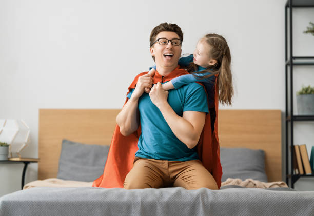 istock Girl and daddy in Superhero costume 1249483820