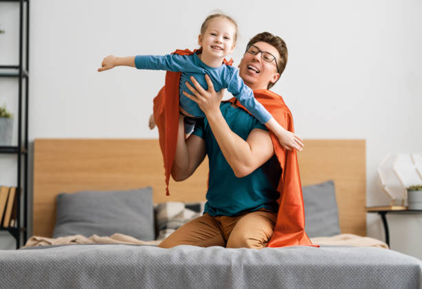 istock Girl and daddy in Superhero costume 1249483823