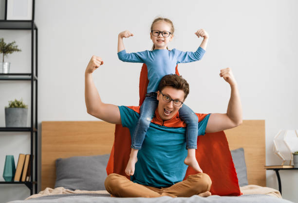 Girl and daddy in Superhero costume