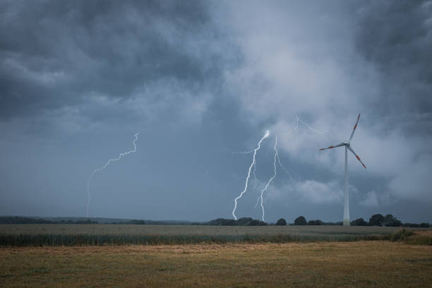 istock a lightning strikes the ground next to a wind turbine 1249489569